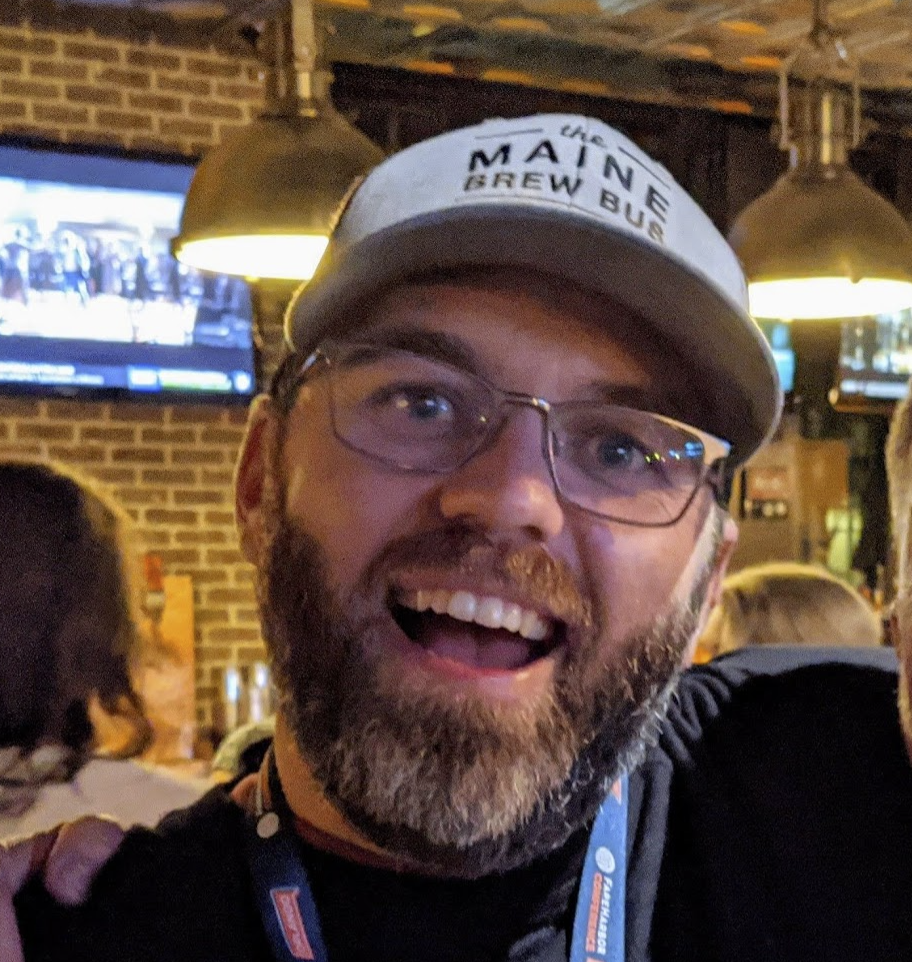 a man wearing a hat and glasses